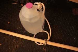 Free Wrist roller made with a wood rod and a jug of water